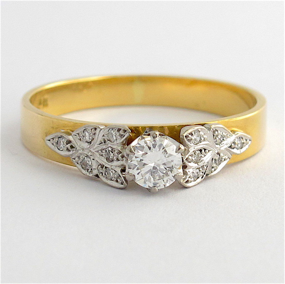 Vintage 18ct yellow and white gold diamond solitaire with fancy design image 0