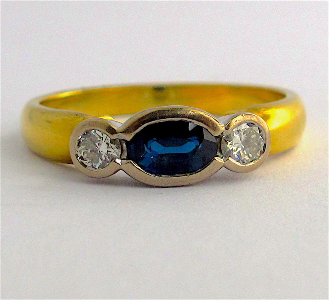 18ct yellow and white gold sapphire and diamond rub over style ring image 0