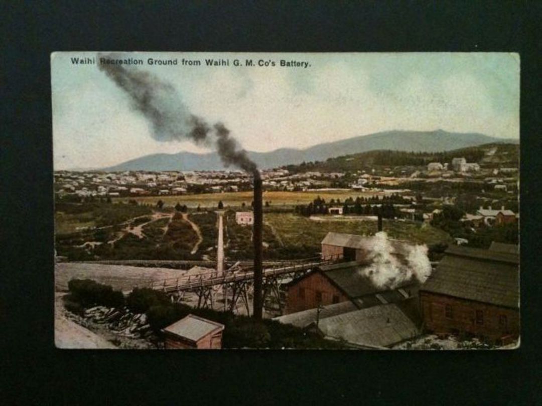 Coloured postcard of Waihi Rec Ground fro the Waihi G M Co Battery. - 46523 - Postcard image 0