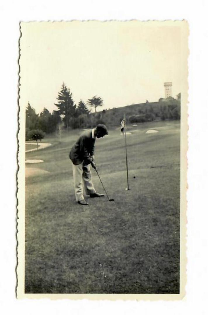 Small Photograph of Golfer putting. With the flag in??? - 41502 - Photograph image 0