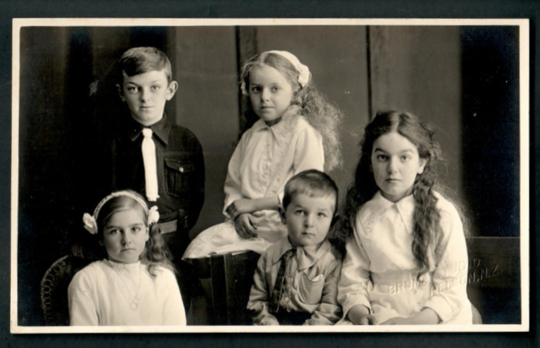 Real Photograph by The Broma Studio Hardy Street Nelson  (at one time owned by  A B Hurst) of a family of five children. - 48619 image 0