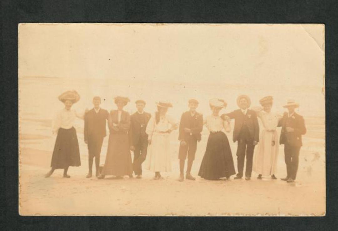 Real Photograph of people taken by Dick Simpson at Dunedin. - 249144 - Postcard image 0