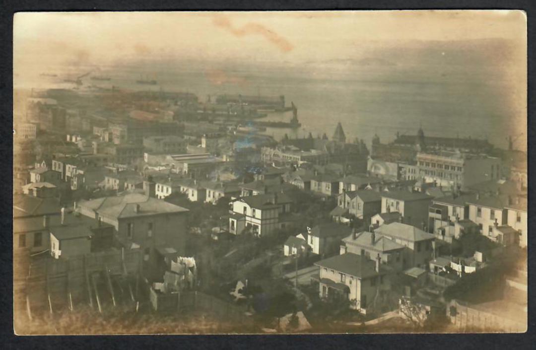 Early Real Photograph of Dunedin and Harbour. DIC building in centre. - 49202 - Postcard image 0