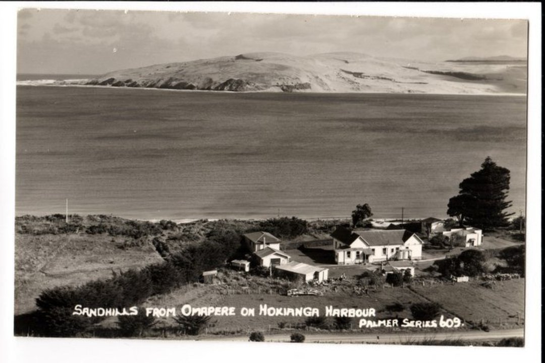 Real Photograph by T G Palmer & Son of the Sandhills from Omapere on the Hokianga Harbour. - 44991 - Postcard image 0