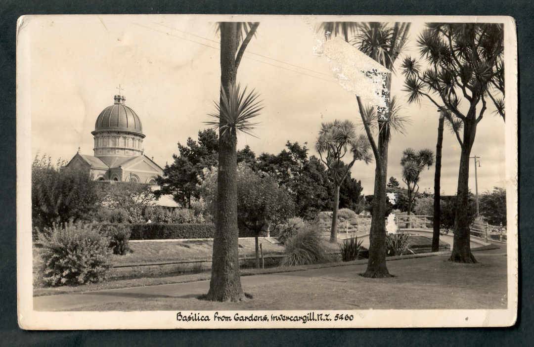 Real Photograph by A B Hurst & Son of Roman Catholic Church Basilica from the Gardens Invercargill. - 49319 - Postcard image 0