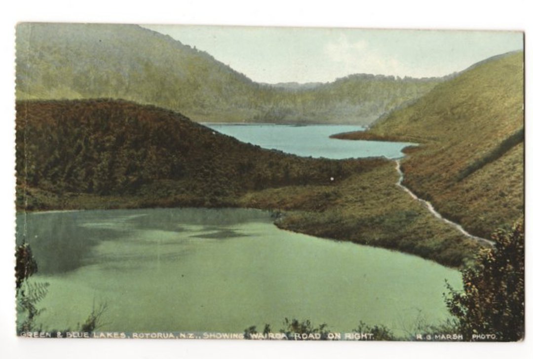 Coloured postcard of Green and Blue Lakes Rotorua showing the Wairoa Road on the right. - 46161 - Postcard image 0