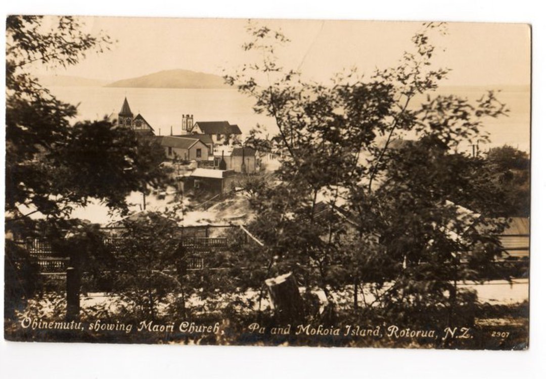 Real Photograph published by Tanner of Ohinemutu showing the Maori Church the pa and Mokoia Island Rotorua. - 69619 - Postcard image 0
