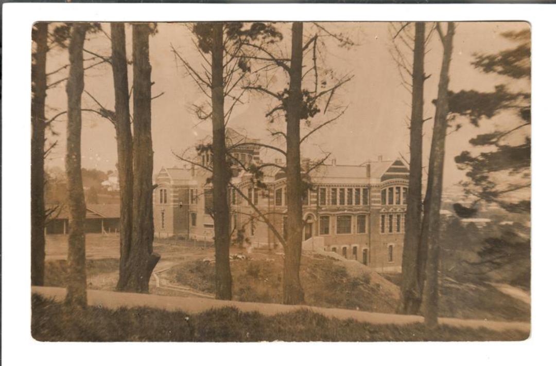Real Photograph of substantial building through trees. Probably Christchurch. - 49781 - Postcard image 0