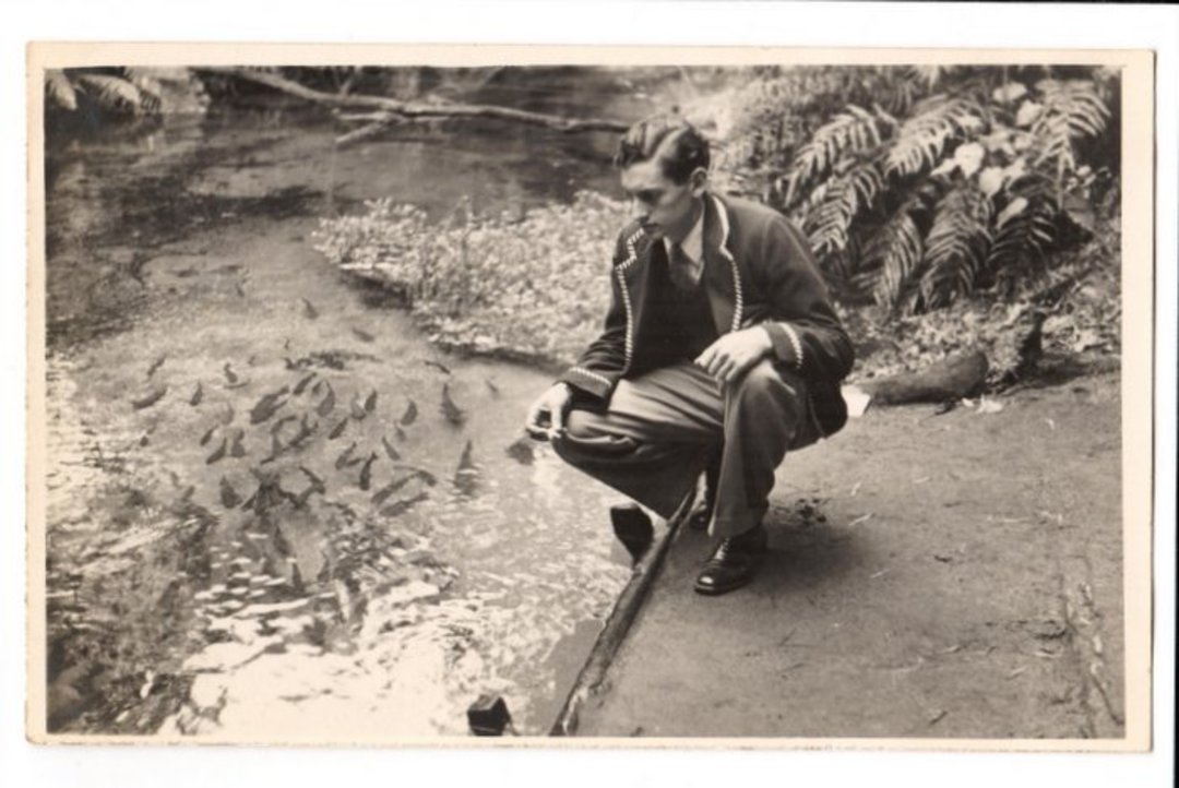 Real Photograph of Cave the N S W sprinter fedding trout at Fairy Springs. - 69771 - Postcard image 0