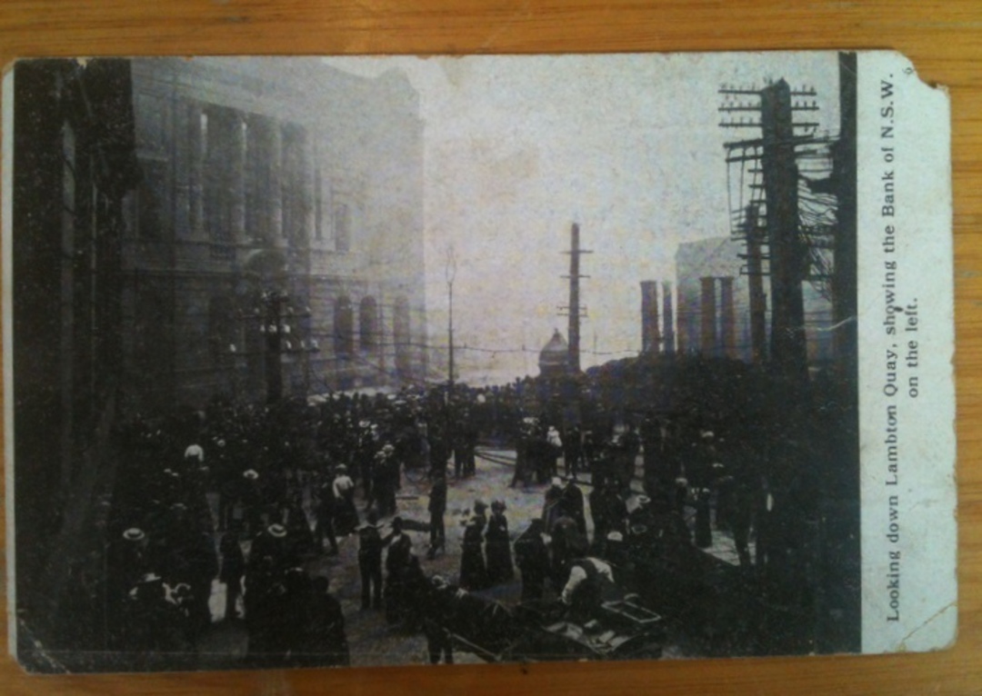 Postcard of The Fire. Faults Faults. Looking down Lambton Quay showing The BNSW on the left. - 47846 - Postcard image 0