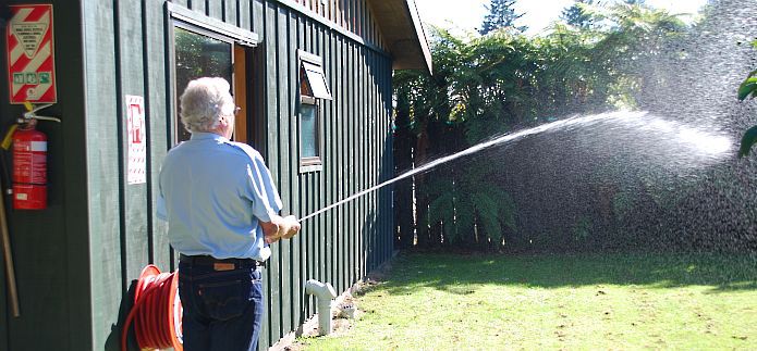 General Fire Employee Testing Fire Hoses