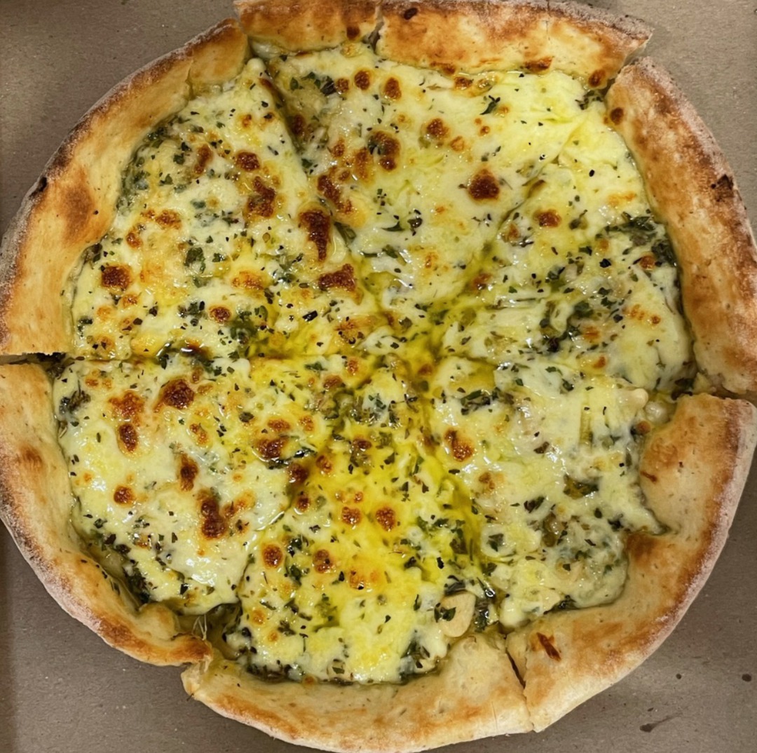 GARLIC PIZZA - WITH CHEESE garlic, garlic butter, cheese & herbs in a deep pan image 0