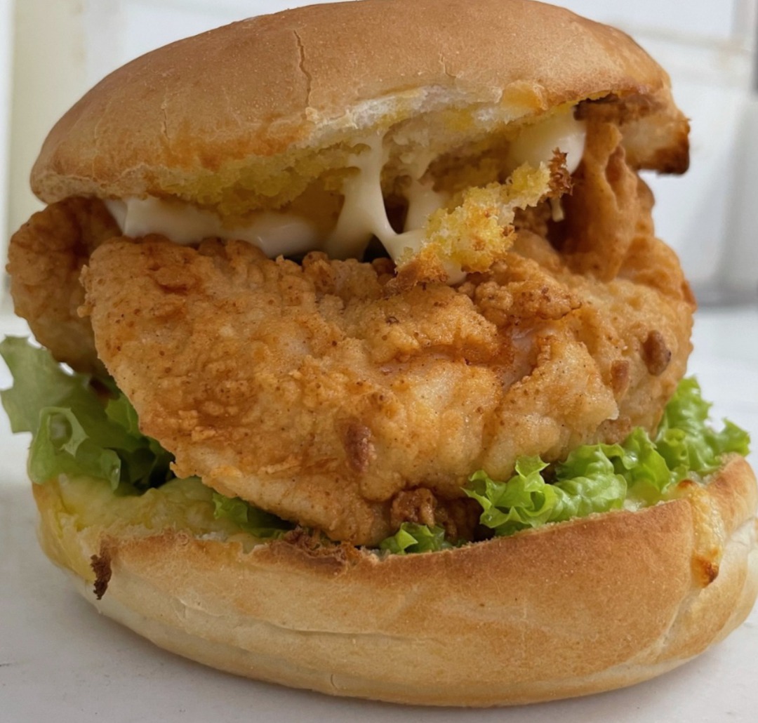 CHICKEN BURGER - coated breast tenders, melted cheese, mayo & lettuce image 0