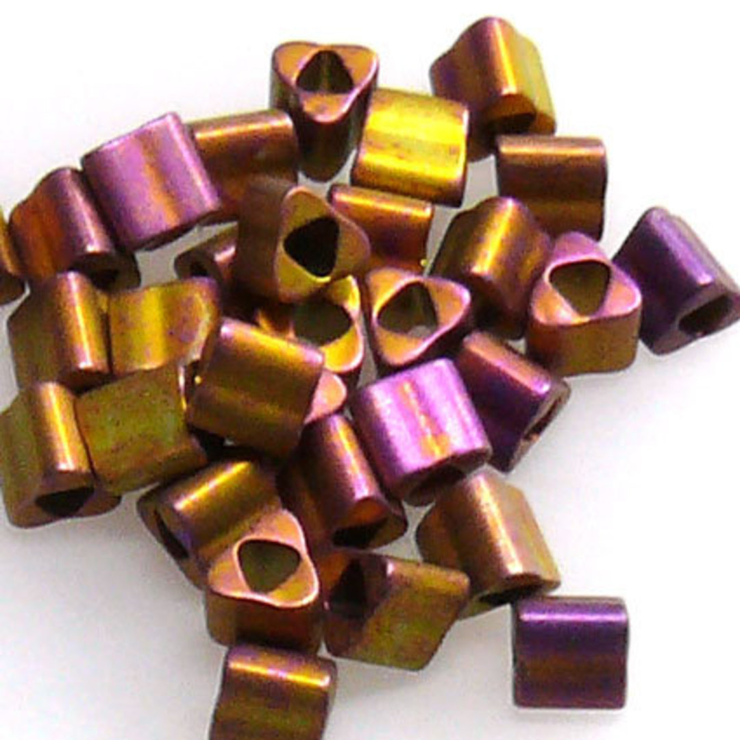 Toho size 8 triangle: F460S - Frosted Metallic Gold/Purple Shimmer (7 grams) image 0