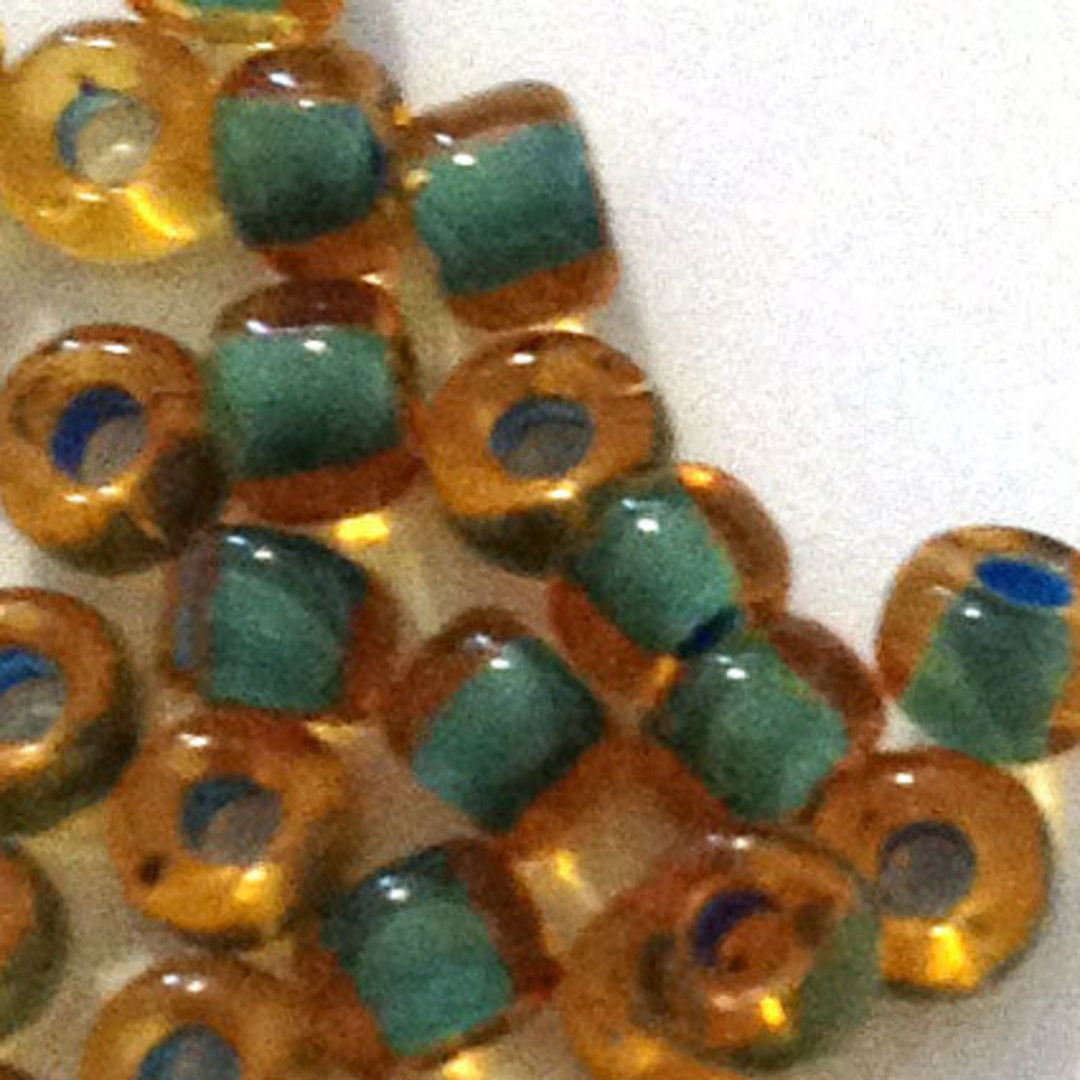 Matsuno size 8 round: 399F - Amber Transparent, teal lined (7 grams) image 0