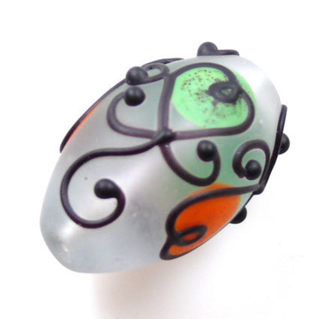 Czech Lampwork Bead: Opaque Oval - Orange, green and black decoration (18 x 30mm) image 0