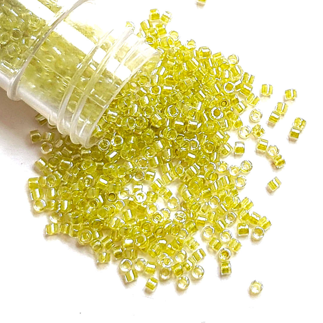 11/0 Miyuki Delica, colour 910 - Sparkling Light Yellow Green lined Crystal (5.4 grams) image 0
