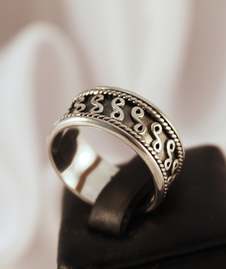 Silver ring with detailed band image 0