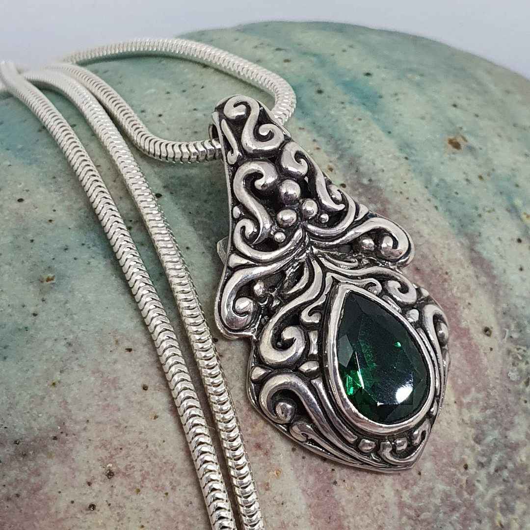 Green quartz pendant set in heavy decorated silver image 1