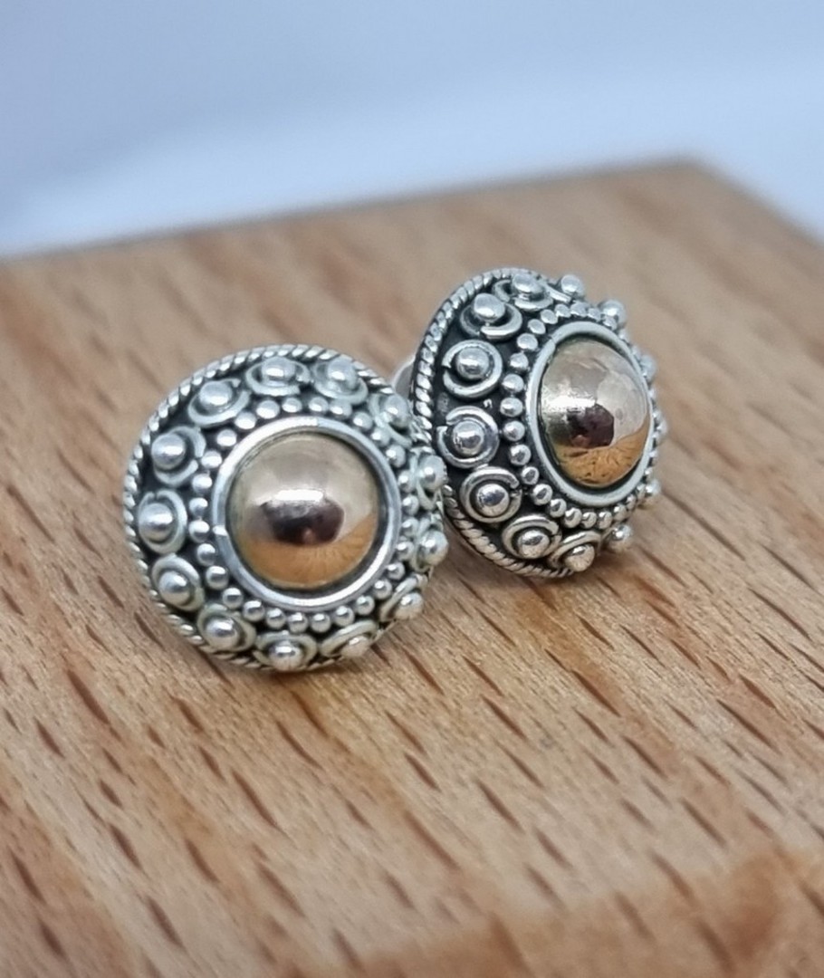 Sterling silver stud earrings with gold detail image 0
