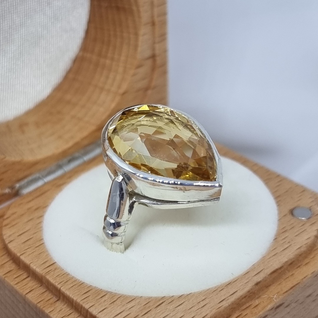 Sterling silver ring with sparkling golden gemstone image 3