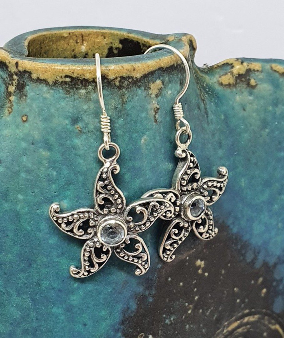 Sterling silver blue topaz flower earrings image 0