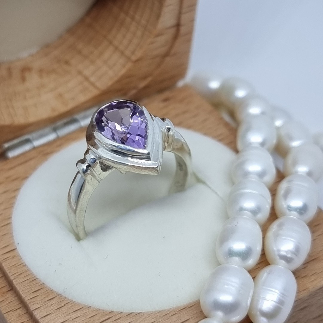 Silver ring with sparkling purple gemstone image 0