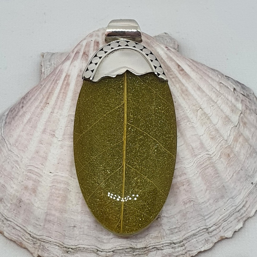 Green skeleton leaf pendant set in sterling silver image 1