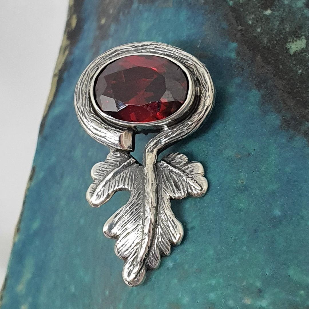 Large red gemstone pendant with silver leaf design image 1