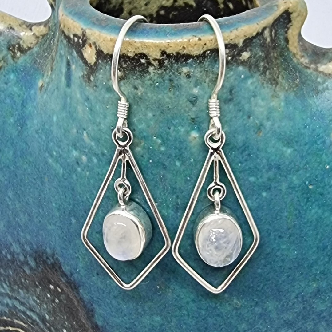Silver hook earrings with oval moonstone image 1