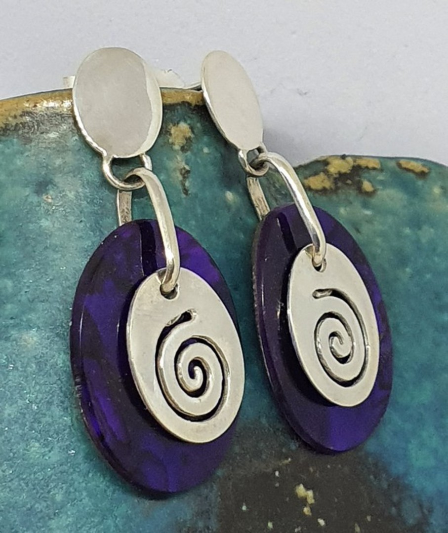 Purple paua shell earrings with silver koru disc image 0