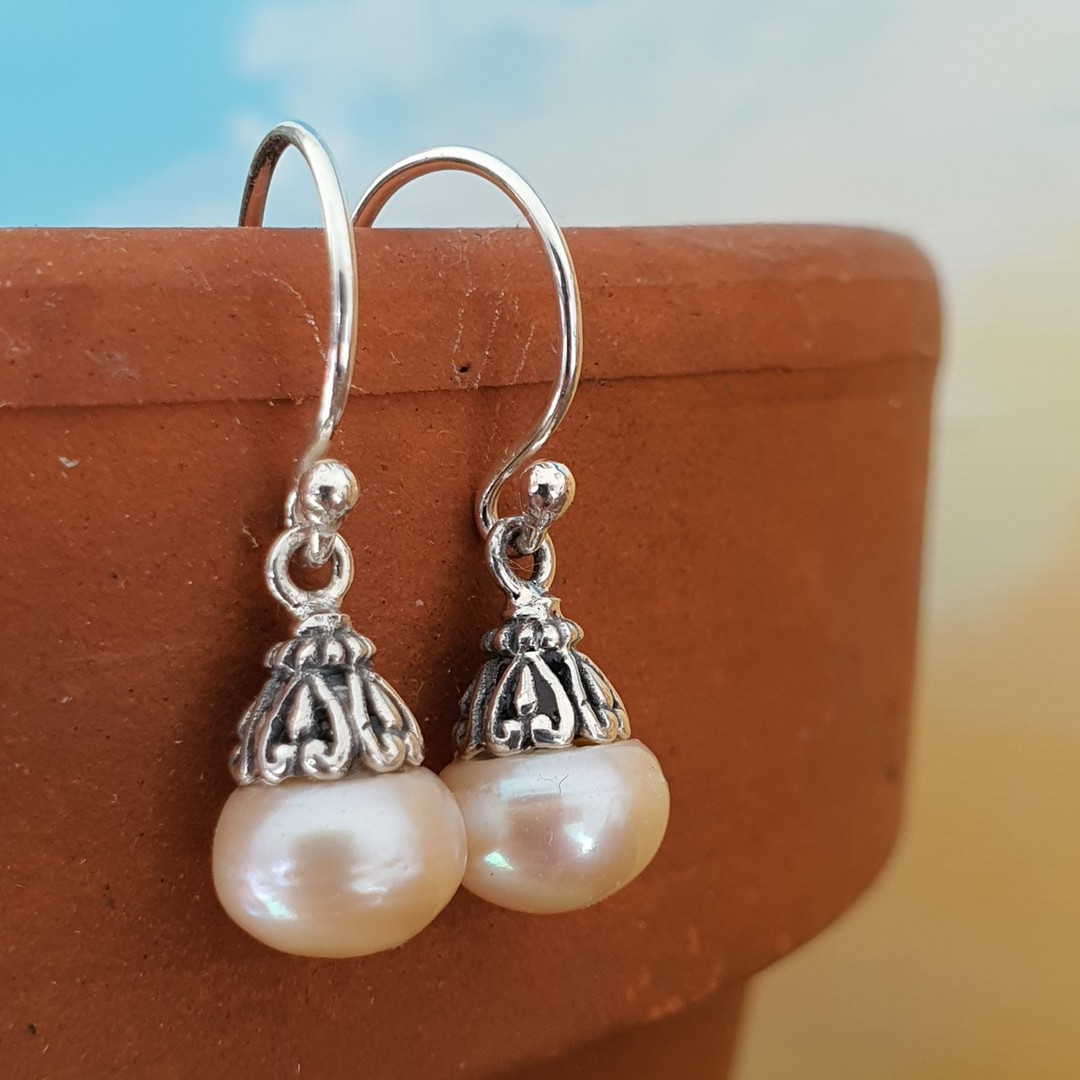 Classic pearl drop earrings with silver detail image 0