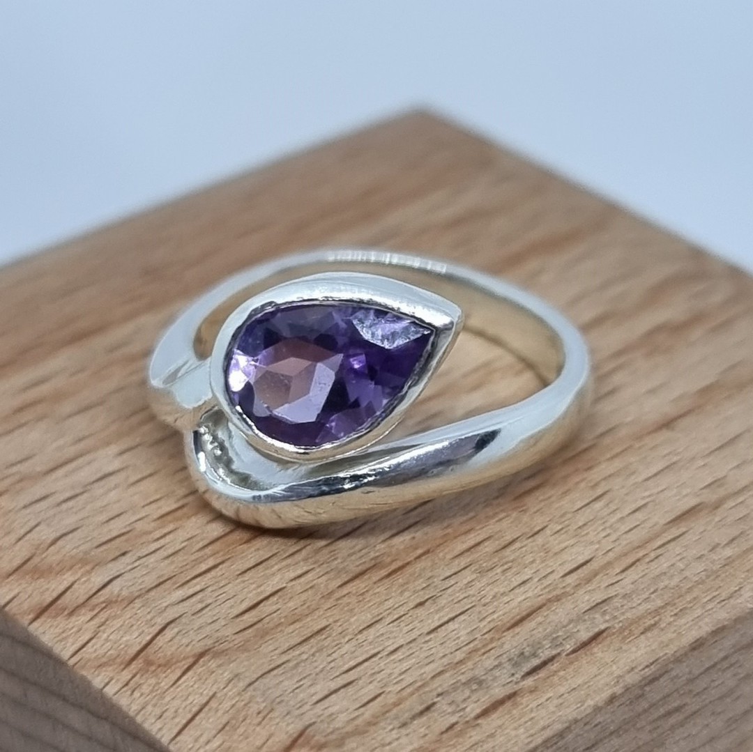 Silver ring with sparkling purple gemstone image 2