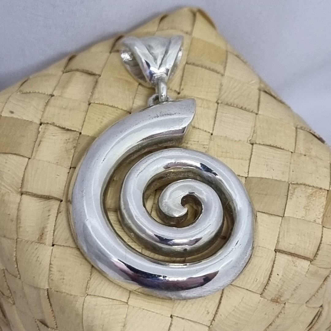 Solid silver koru pendant - made in NZ image 1