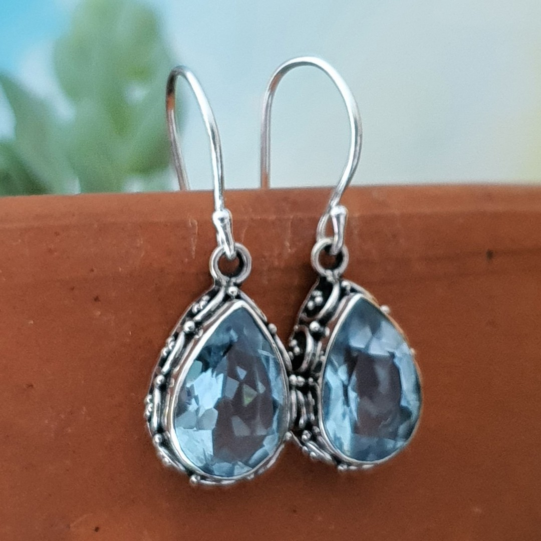 Dazzling blue topaz teardrop silver hook earrings image 0