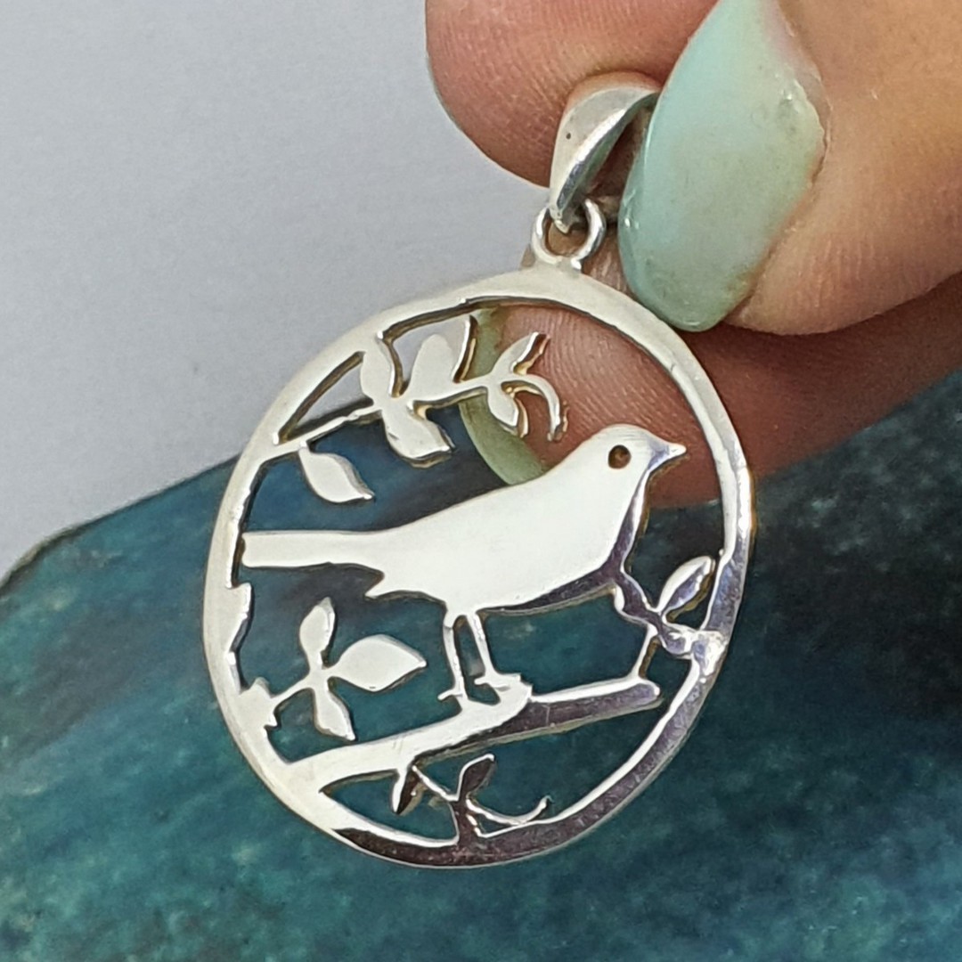 Silver pendant with a bird in a tree image 2