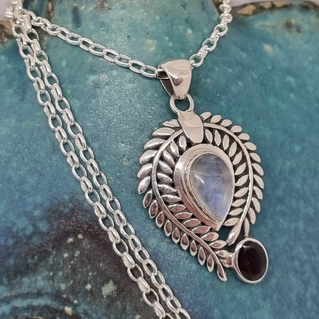 Sterling silver ornate moonstone and garnet pendant image 1