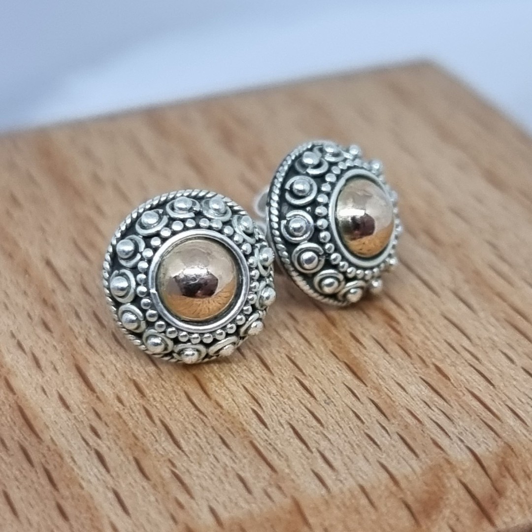 Sterling silver stud earrings with gold detail image 1