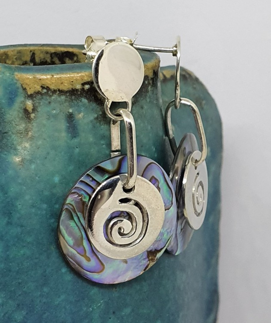Round silver paua shell earrings with silver koru disc image 1