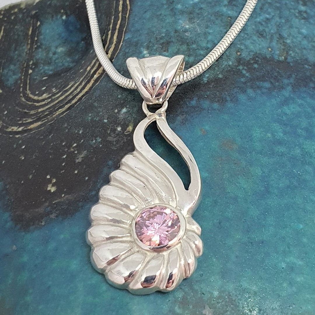 Curved silver shell pendant with pink gemstone image 3