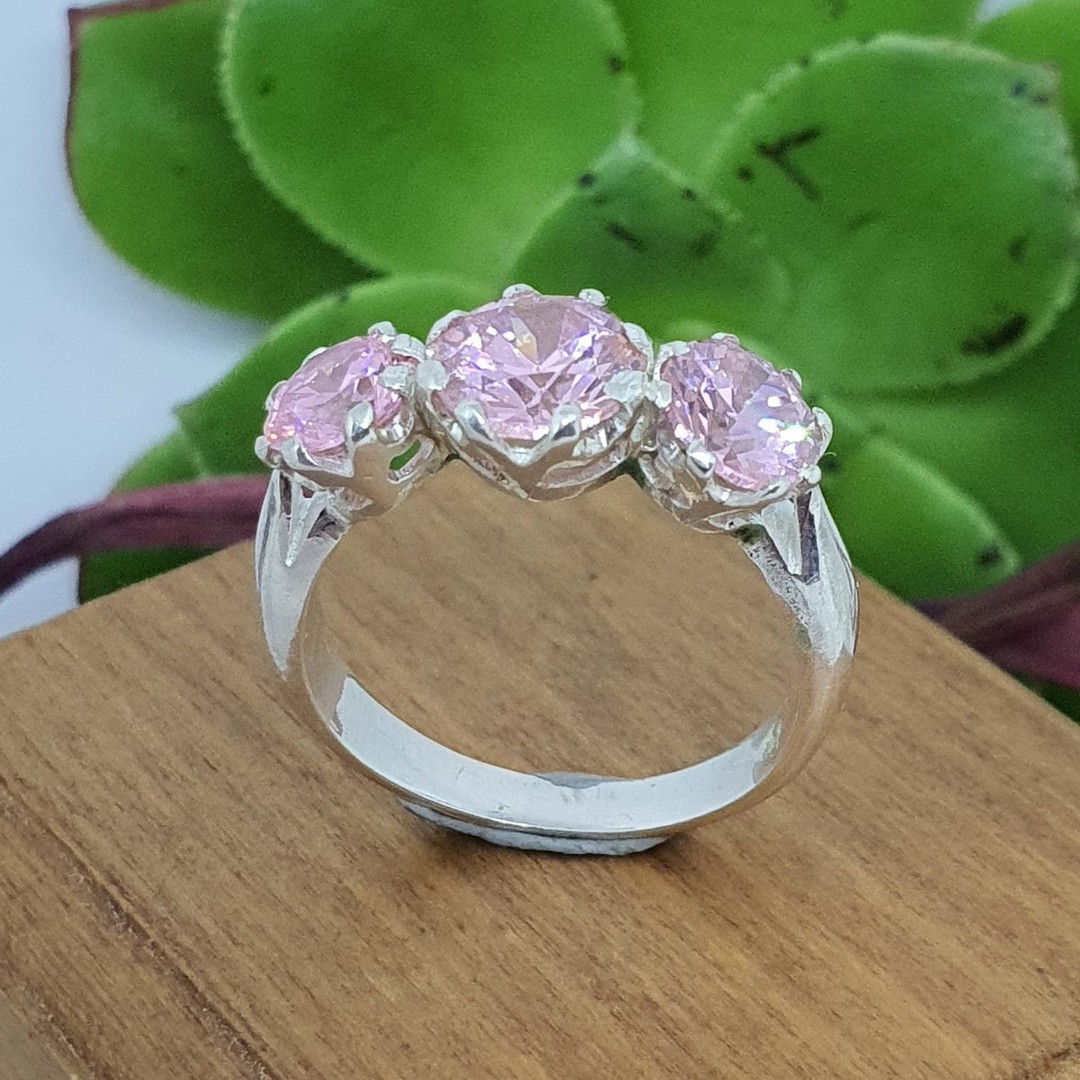 Sterling silver ring with sparkling pink gemstones - Size O image 0