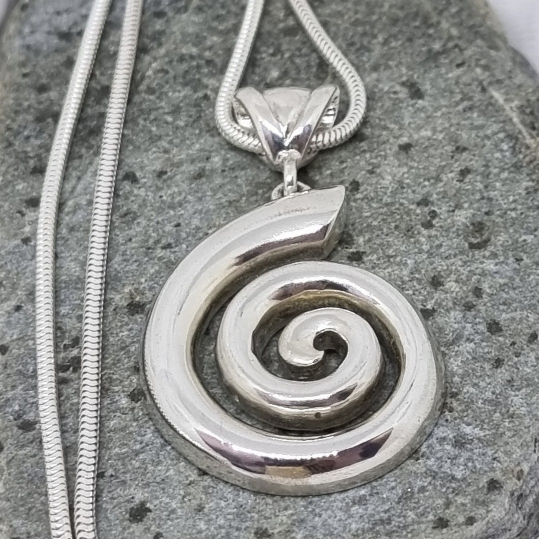 Solid silver koru pendant - made in NZ image 4