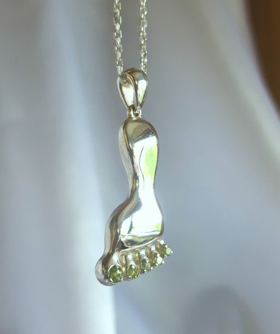 Made in NZ, quirky silver foot pendant with peridot image 0