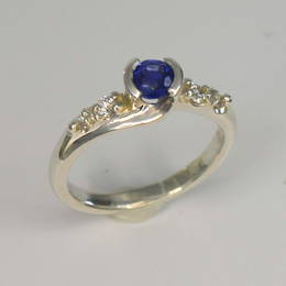 Sapphire and Diamond koru engagement ring in white gold