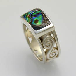 R359  Paua Shell set in Stg.Silver with spiral koru band.