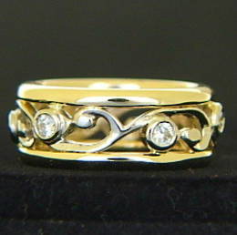 R251 6x Diamonds set  around a carved koru design wedding ring