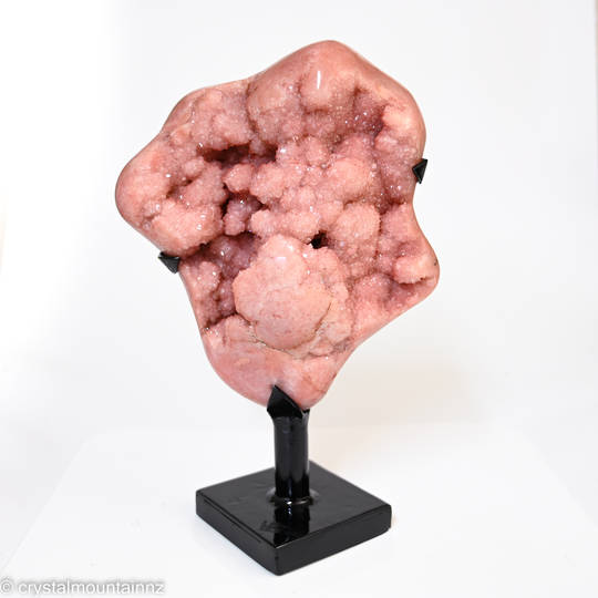 Pink Amethyst Druze on a metal stand.