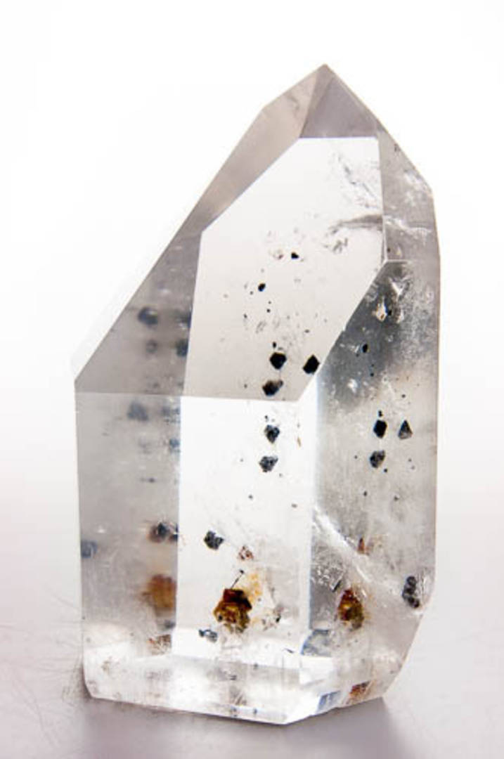 Clear Quartz with Columbite Inclusions Polished Point image 1