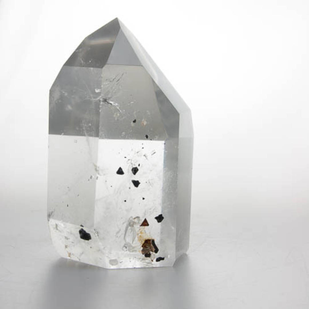Clear Quartz with Columbite Inclusions Polished Point image 0