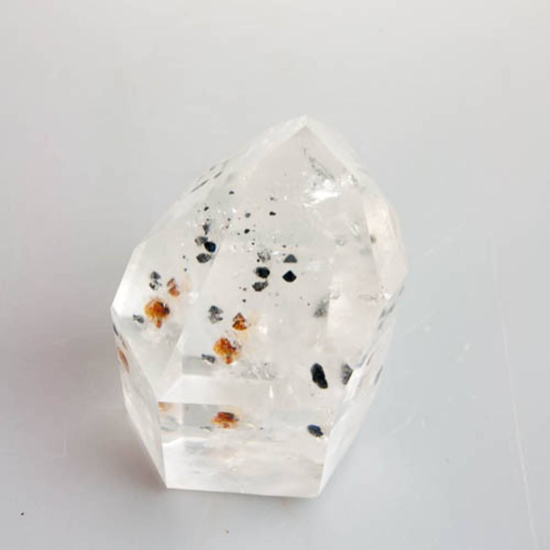 Clear Quartz with Columbite Inclusions Polished Point image 6